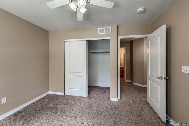 1419 Red Mountain Dr Unit 126, Longmont, CO 80504 - unfurnished bedroom with carpet floors, a closet, and a ceiling fan