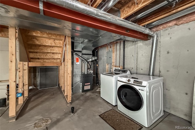 1419 Red Mountain Dr Unit 126, Longmont, CO 80504 - unfinished below grade area featuring washing machine and dryer, heating unit, and electric panel