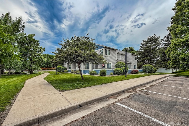 1419 Red Mountain Dr Unit 126, Longmont, CO 80504 - view of front facade with uncovered parking and a front yard
