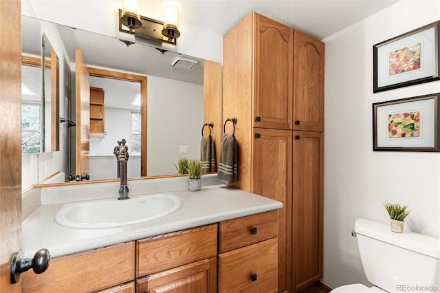 7636 S Allison Ct, Littleton, CO 80128 - bathroom featuring vanity and healthy amount of natural light