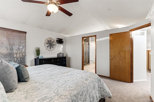 7636 S Allison Ct, Littleton, CO 80128 - bedroom with lofted ceiling, light carpet, a textured ceiling, ensuite bathroom, and a ceiling fan