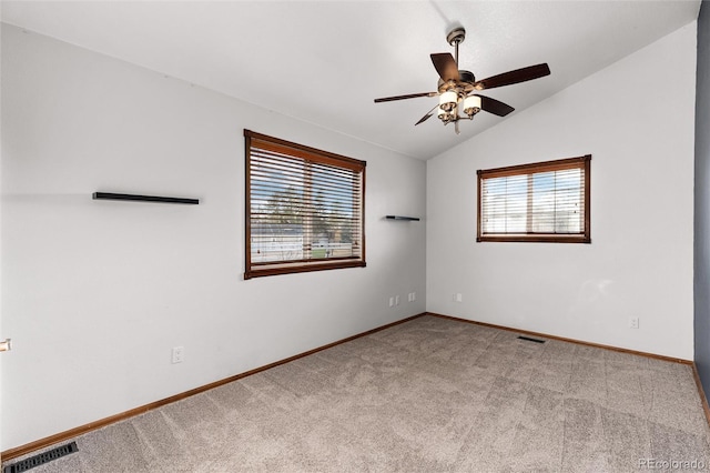 7636 S Allison Ct, Littleton, CO 80128 - spare room featuring vaulted ceiling, carpet, and a ceiling fan