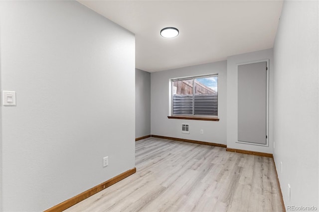 7636 S Allison Ct, Littleton, CO 80128 - spare room featuring wood finished floors