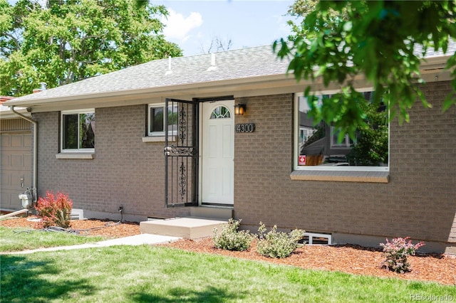 4300 Osage St, Denver, CO 80211 - ranch-style home with an attached garage, brick siding, a front lawn, and roof with shingles