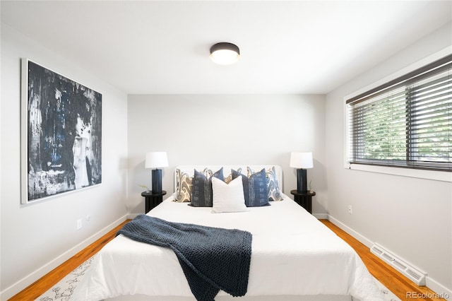 4300 Osage St, Denver, CO 80211 - bedroom featuring baseboard heating and wood finished floors