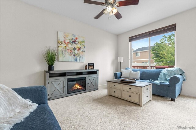 5536 Kirk St, Denver, CO 80249 - living room with light colored carpet, ceiling fan, and a glass covered fireplace