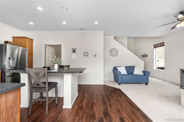 5536 Kirk St, Denver, CO 80249 - kitchen with stainless steel refrigerator with ice dispenser, dark countertops, a ceiling fan, brown cabinetry, and recessed lighting