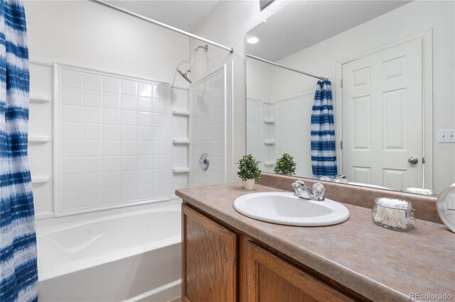 5536 Kirk St, Denver, CO 80249 - bathroom featuring shower / bathtub combination with curtain and vanity