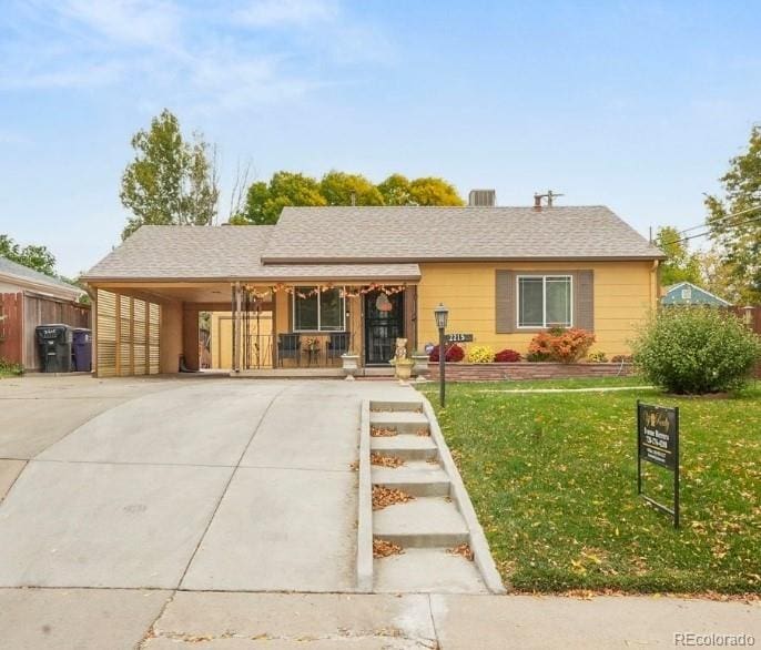 ranch-style house with a front lawn and a carport