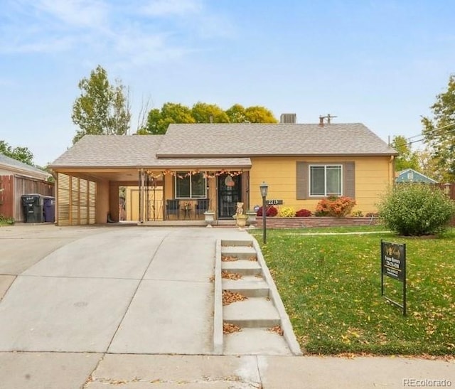 ranch-style house with a front lawn and a carport