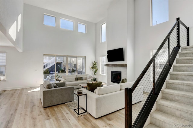 living room with plenty of natural light and light wood-type flooring