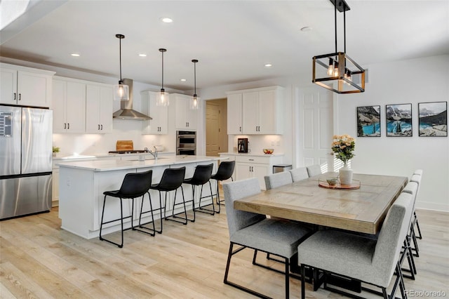 dining room with light hardwood / wood-style flooring