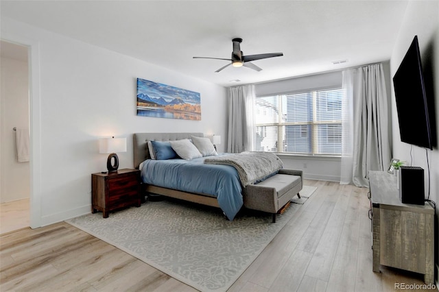 bedroom with light hardwood / wood-style flooring and ceiling fan