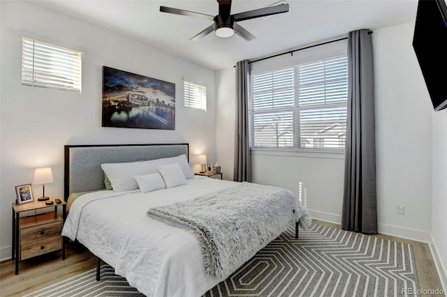 bedroom featuring hardwood / wood-style flooring and ceiling fan