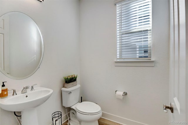 bathroom with sink and toilet