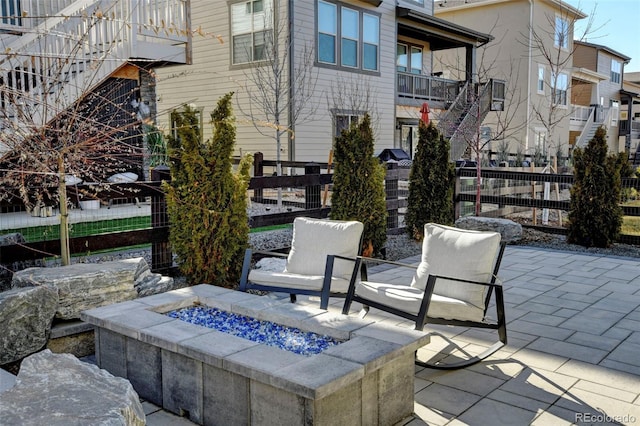 view of patio with an outdoor fire pit