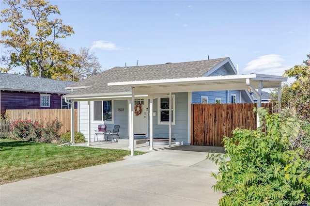 view of front of house with a front yard and covered porch