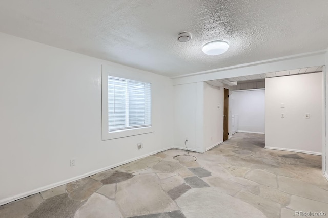 10723 Cherry Ct, Thornton, CO 80233 - unfurnished room with light stone finish flooring, a textured ceiling, and baseboards