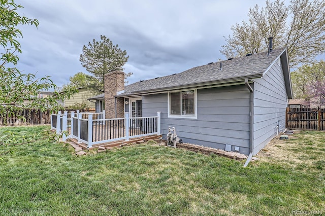 10723 Cherry Ct, Thornton, CO 80233 - back of property featuring a shingled roof and a deck