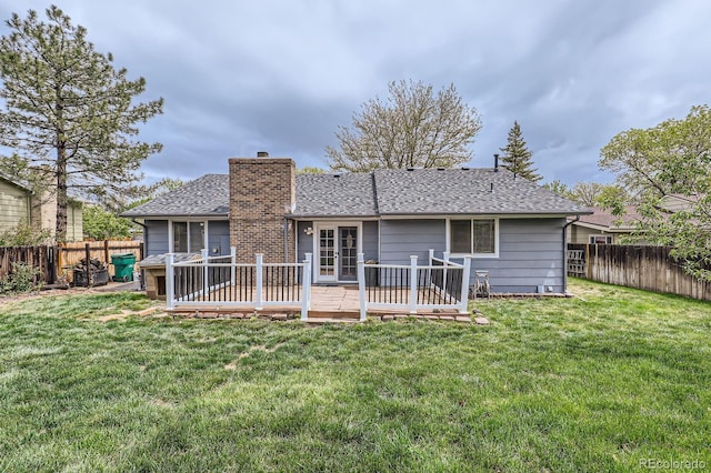 10723 Cherry Ct, Thornton, CO 80233 - back of house with a chimney, a wooden deck, and a shingled roof