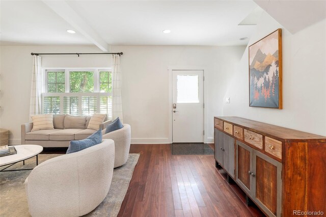 623 S Logan St, Denver, CO 80209 - living room with beamed ceiling, dark wood-style floors, plenty of natural light, and baseboards