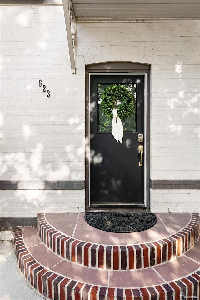 623 S Logan St, Denver, CO 80209 - property entrance with brick siding