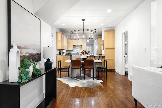 623 S Logan St, Denver, CO 80209 - kitchen featuring light brown cabinetry, a chandelier, dark wood-type flooring, backsplash, and recessed lighting