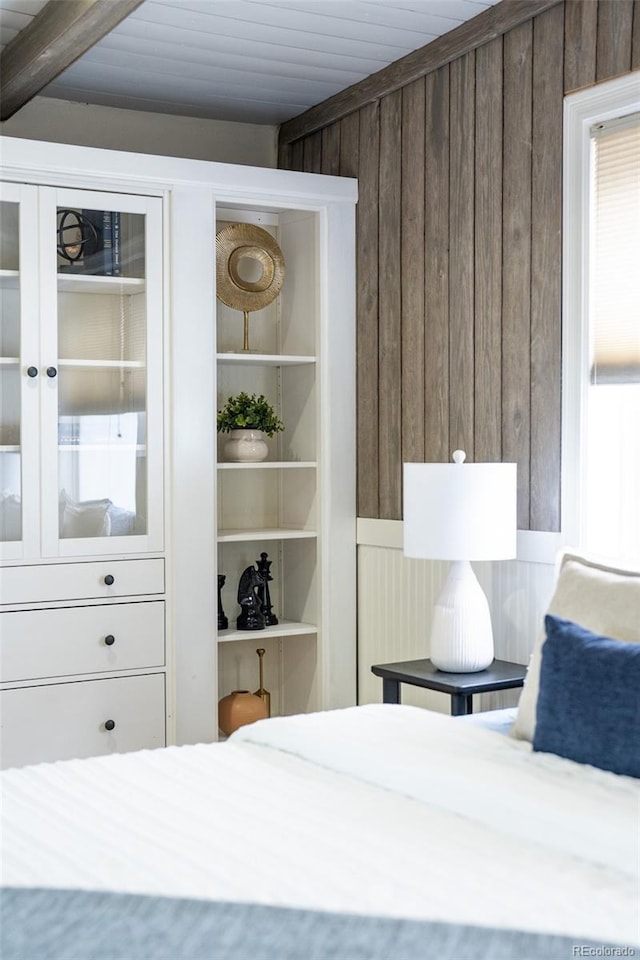 623 S Logan St, Denver, CO 80209 - bedroom featuring wooden walls and a wooden ceiling with exposed beams