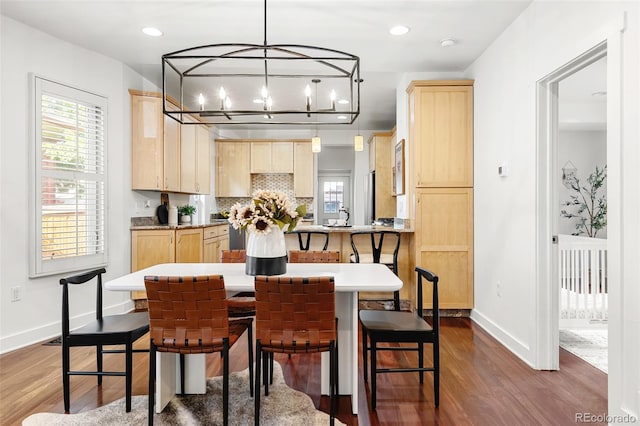623 S Logan St, Denver, CO 80209 - dining space with dark wood finished floors, recessed lighting, and a chandelier