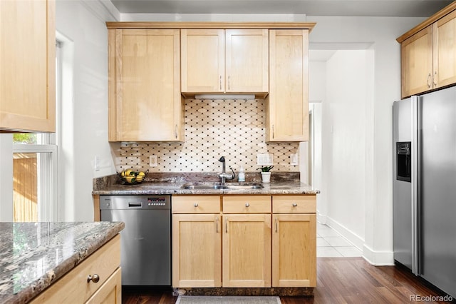 623 S Logan St, Denver, CO 80209 - kitchen with stainless steel appliances, backsplash, light brown cabinetry, and dark wood-type flooring