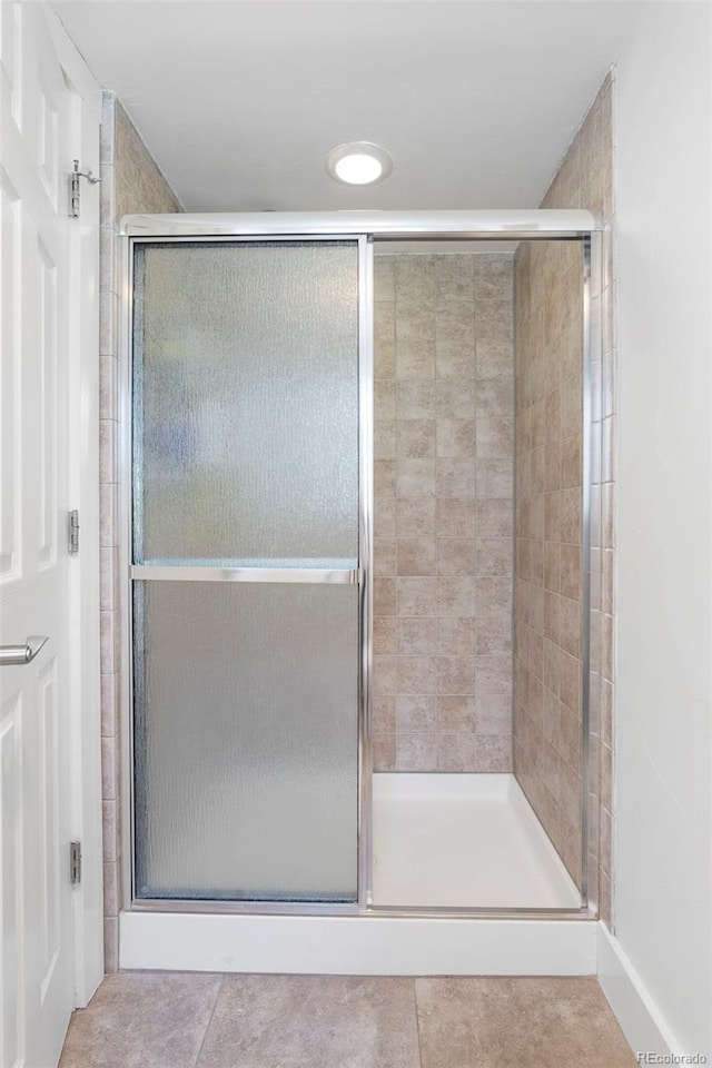 623 S Logan St, Denver, CO 80209 - full bathroom featuring a stall shower and tile patterned floors