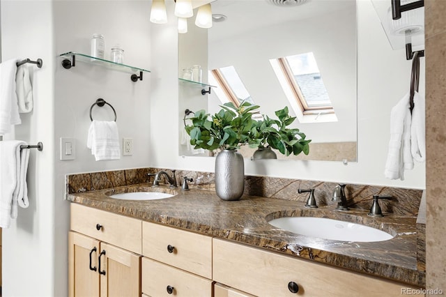 623 S Logan St, Denver, CO 80209 - bathroom featuring a skylight and double vanity