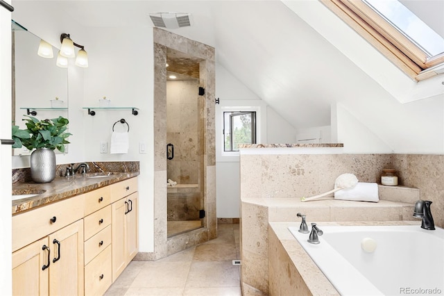 623 S Logan St, Denver, CO 80209 - bathroom featuring a skylight, a garden tub, vanity, a stall shower, and lofted ceiling