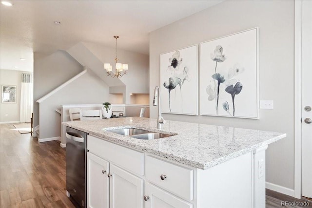kitchen featuring an inviting chandelier, a sink, white cabinets, dark wood finished floors, and dishwasher