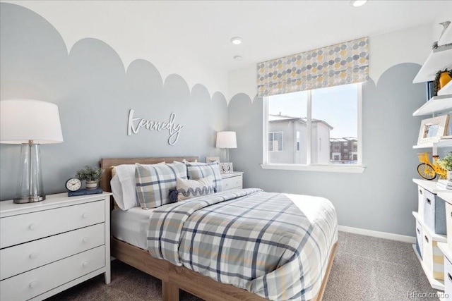 carpeted bedroom featuring baseboards and recessed lighting