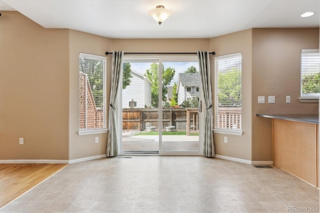 4016 S Rome St, Aurora, CO 80018 - empty room with baseboards and light tile patterned flooring