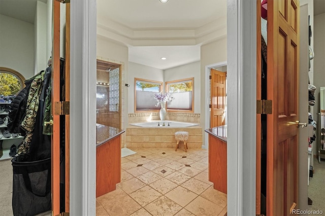 full bath with recessed lighting, a bath, and vanity