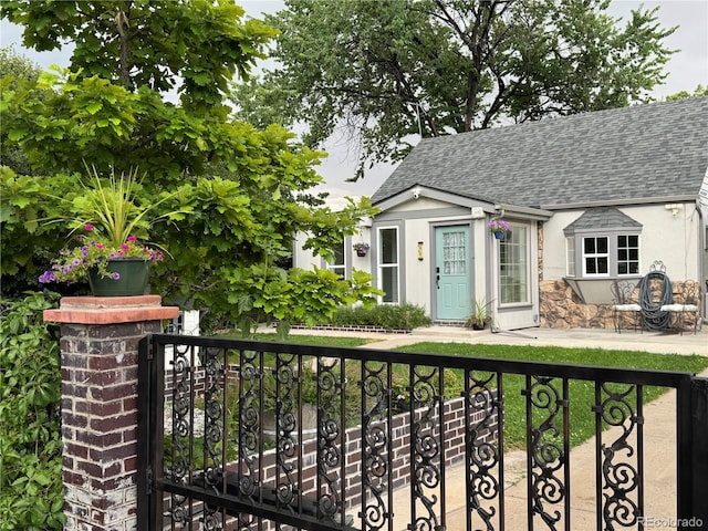 1946 Xenia St, Denver, CO 80220 - view of front of property with roof with shingles and stucco siding