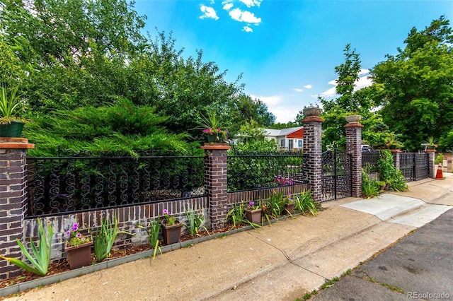 1946 Xenia St, Denver, CO 80220 - gate featuring a fenced front yard