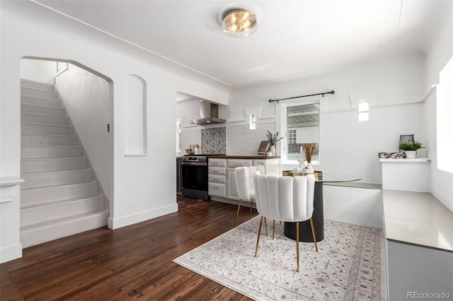 1946 Xenia St, Denver, CO 80220 - dining area featuring dark wood-style flooring and stairway