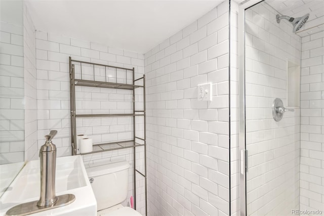 1946 Xenia St, Denver, CO 80220 - bathroom with a shower stall and tile walls