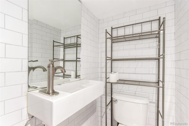 1946 Xenia St, Denver, CO 80220 - bathroom with tile walls and toilet