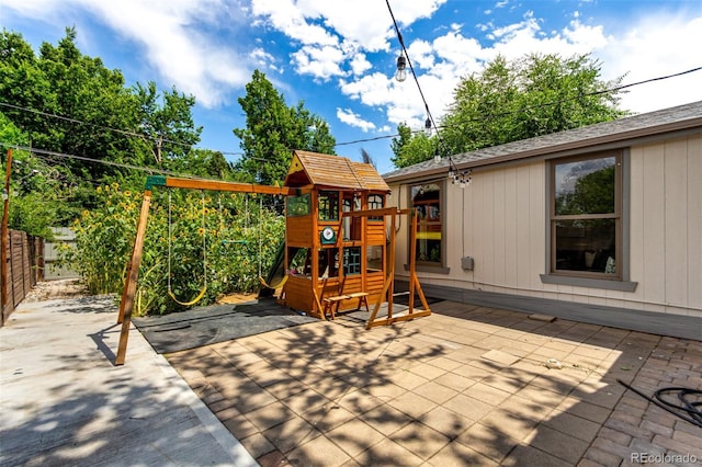 1946 Xenia St, Denver, CO 80220 - view of patio featuring a playground