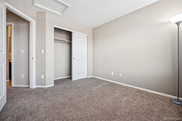 unfurnished bedroom with a closet and carpet