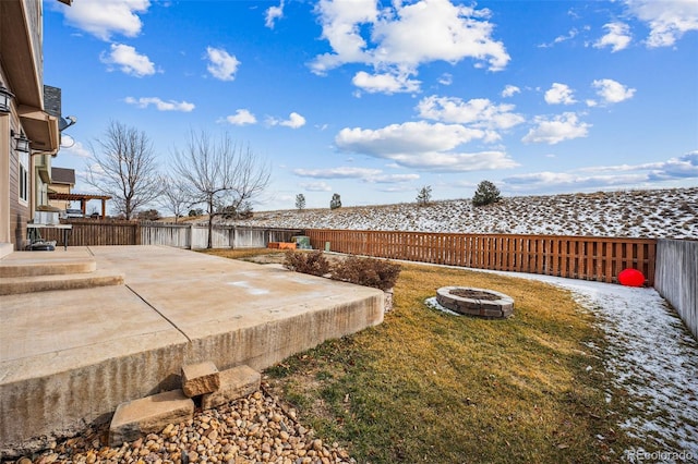 view of yard with a patio and a fire pit