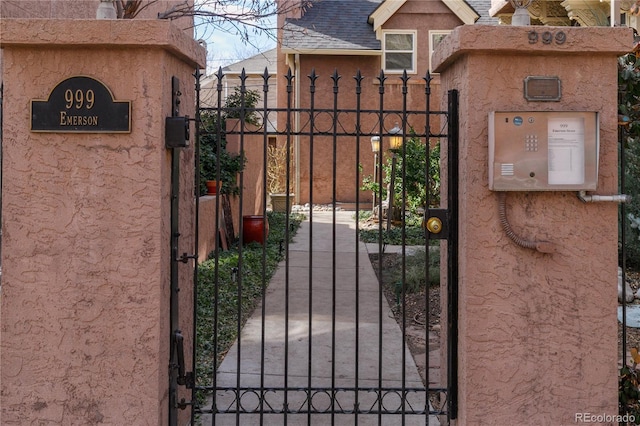 view of gate with fence