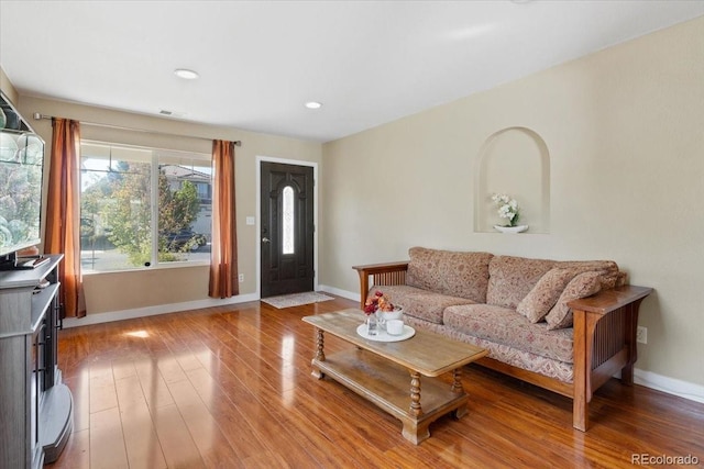 5555 Perth Ct, Denver, CO 80249 - living area with light wood finished floors, baseboards, recessed lighting, and visible vents