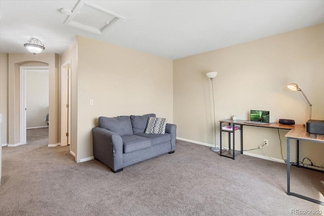 sitting room featuring light colored carpet