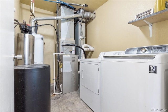 clothes washing area featuring washer and dryer