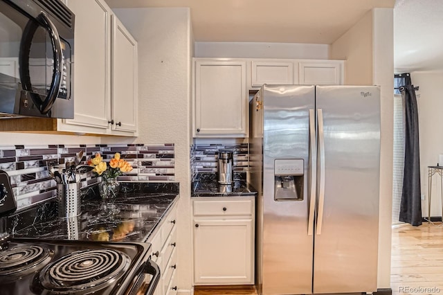 8751 Pearl St Unit J3, Thornton, CO 80229 - kitchen featuring stainless steel refrigerator with ice dispenser, black microwave, range with electric stovetop, dark stone counters, and white cabinets